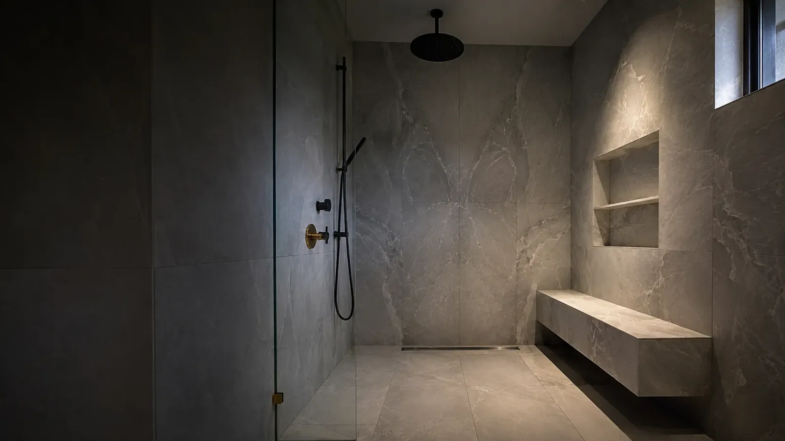 Marble-look porcelain shower installed by OXXO Tile Company in Toronto
