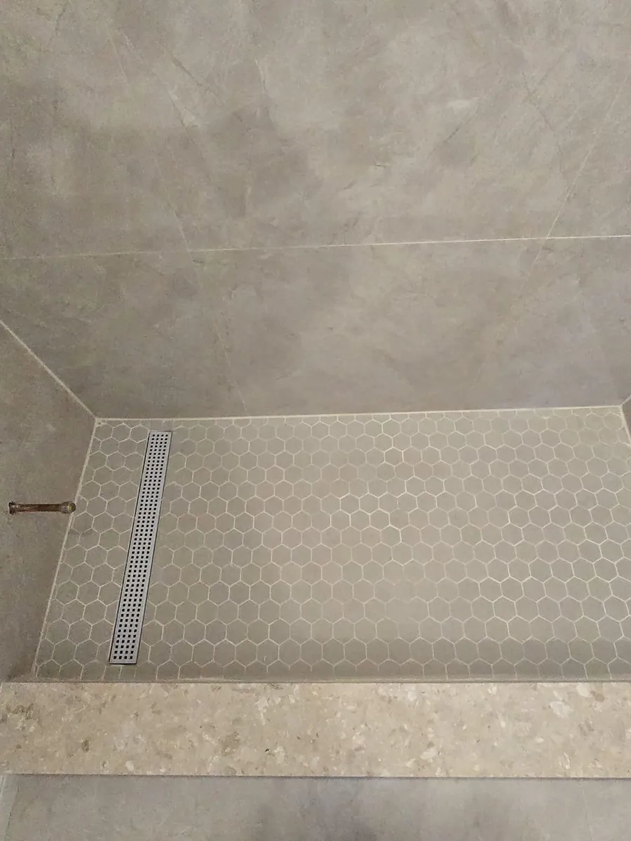 Shower pan with linear drain