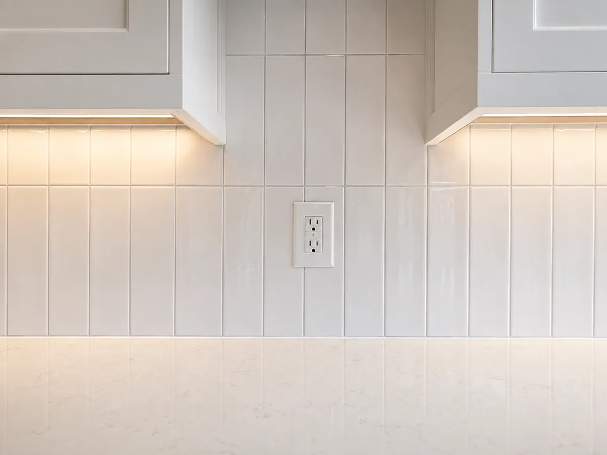 White subway tile kitchen backsplash with tight grout joints